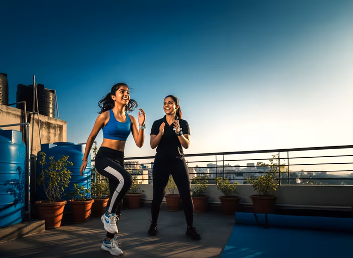 Women Trainer Working Out with a women